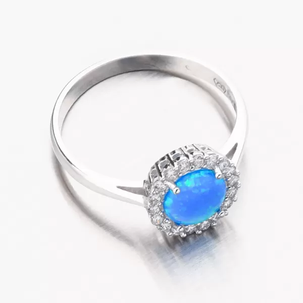 Prsten z bílého zlata s modrým opálem a se zirkony 11R-351