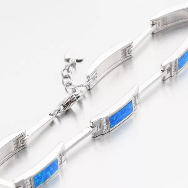Stříbrný náramek s modrým opálem a se zirkony PKL-4041
