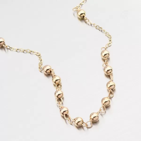 Zlatý kuličkový náramek s křížem 14R-034