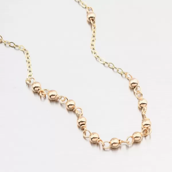 Zlatý kuličkový náramek s křížem 14R-031